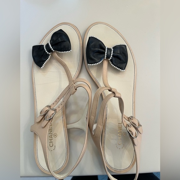 CHANEL Shoes - Authentic black and beige Chanel pearl bow flat sandal size 42C